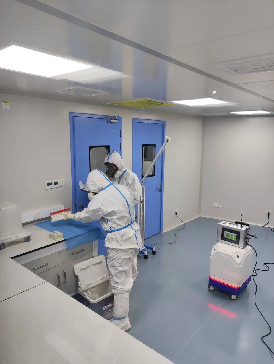 VanTsteri team carrying out on-site sampling in a controlled room